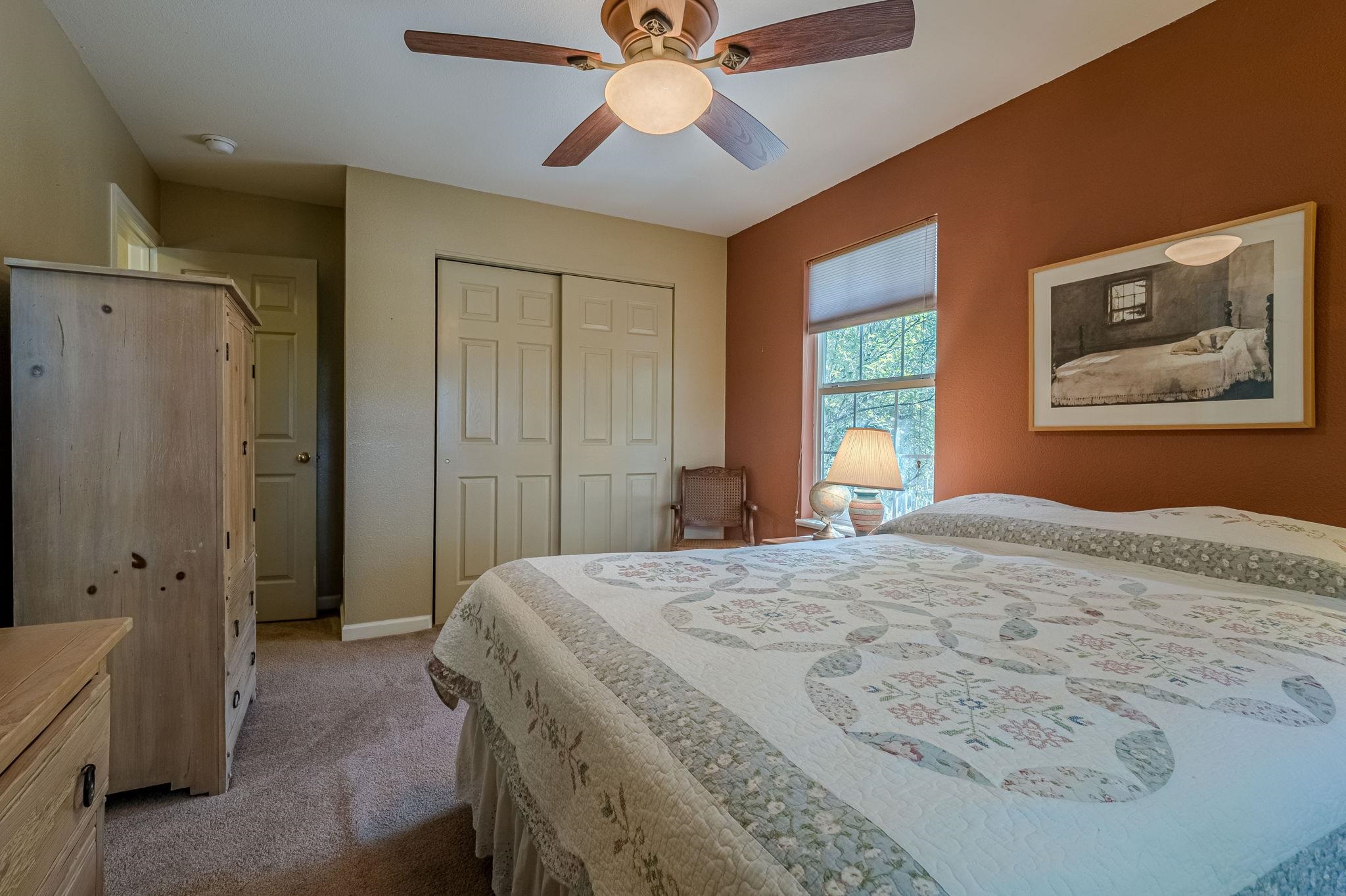 3613 G Road, Unit E Palisade, CO 81526 - Photo 15 of 42 a bedroom with a bed and a chandelier