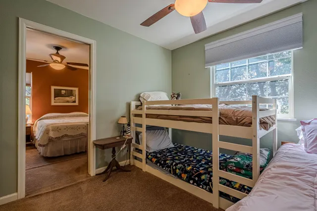 a dining room with furniture and a view of kitchen