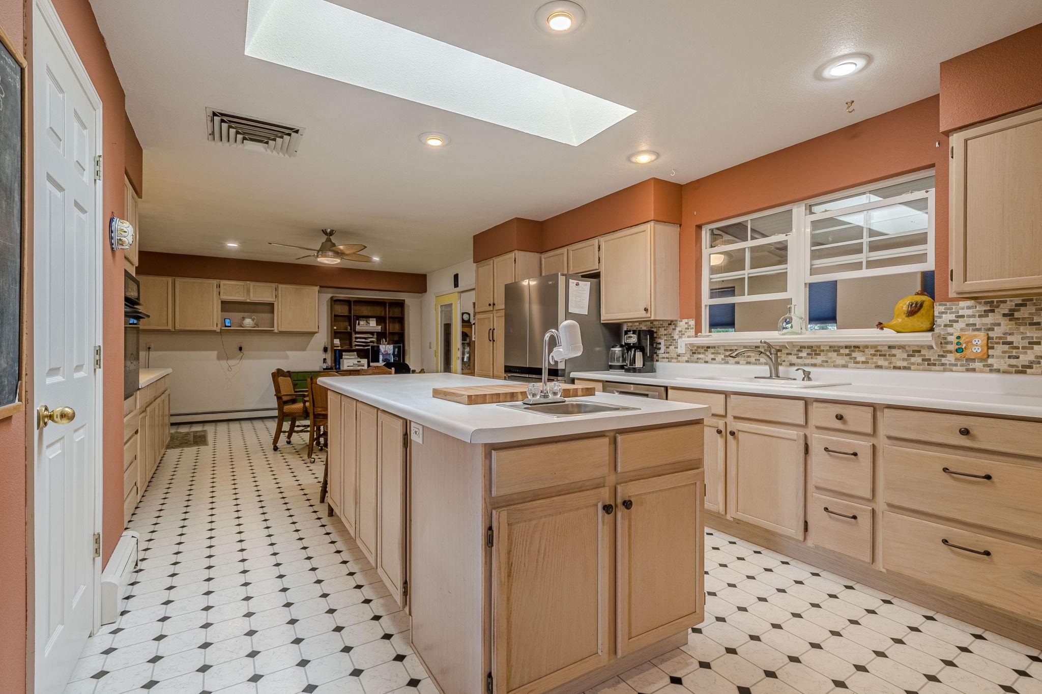 3613 G Road, Unit E Palisade, CO 81526 - Photo 23 of 42 a kitchen with a sink stove and cabinets