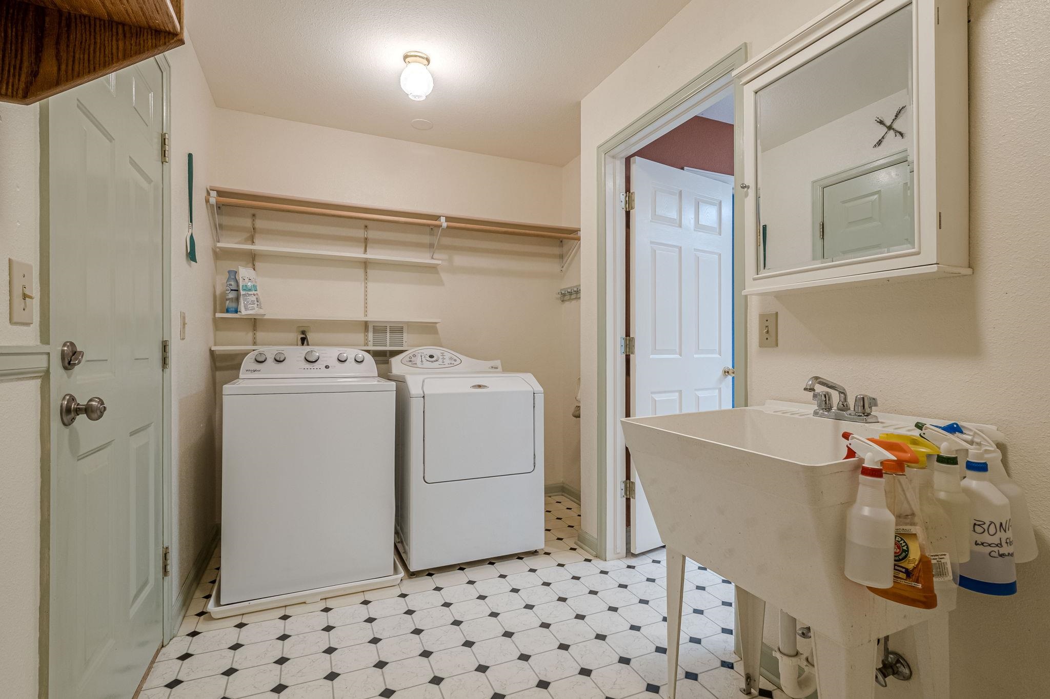 3613 G Road, Unit E Palisade, CO 81526 - Photo 26 of 42 a room with a white cabinets and washer dryer