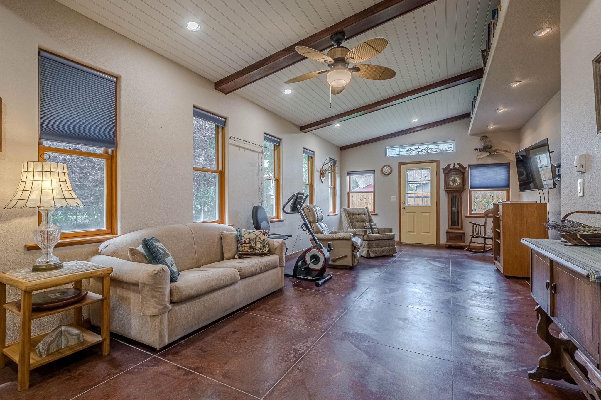 3613 G Road, Unit E Palisade, CO 81526 - Photo 28 of 42 a living room with furniture and wooden floor