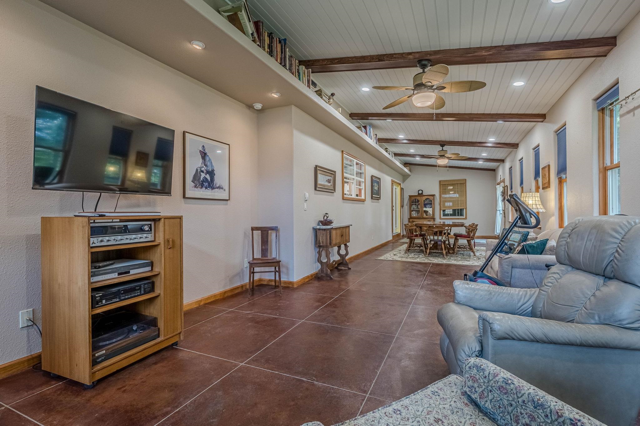 3613 G Road, Unit E Palisade, CO 81526 - Photo 29 of 42 a living room with furniture and a flat screen tv