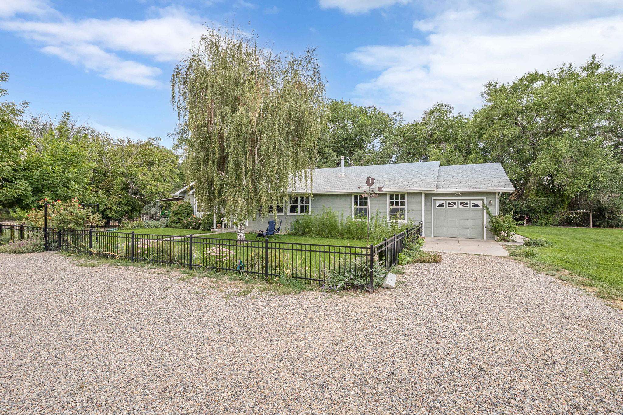 3613 G Road, Unit E Palisade, CO 81526 - Photo 3 of 42 front view of a house with a yard