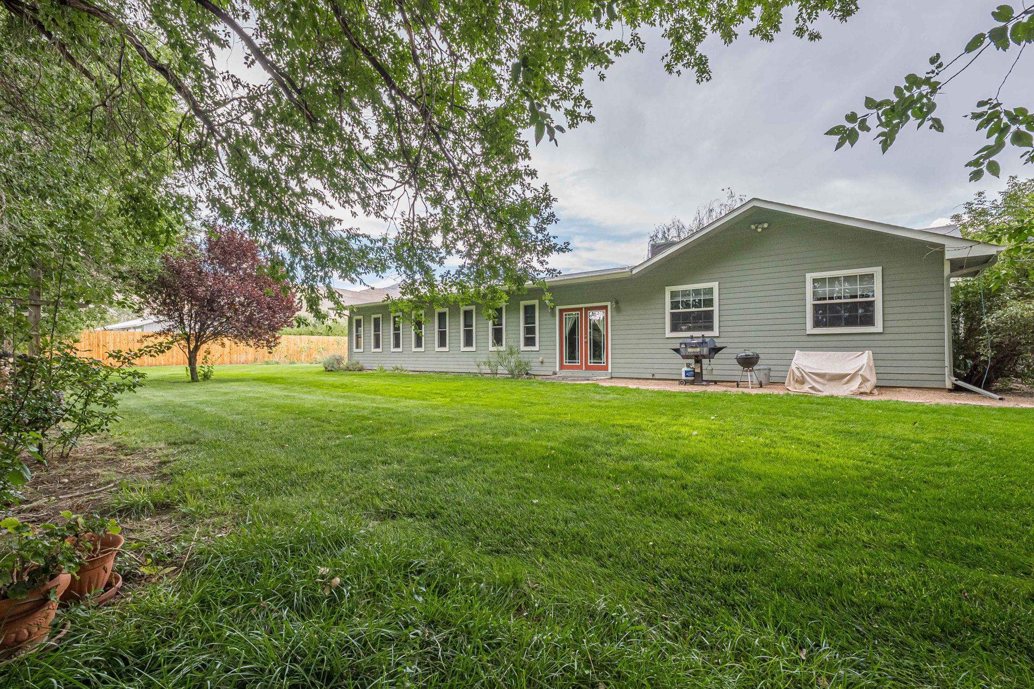 3613 G Road, Unit E Palisade, CO 81526 - Photo 40 of 42 a front view of house with yard and green space