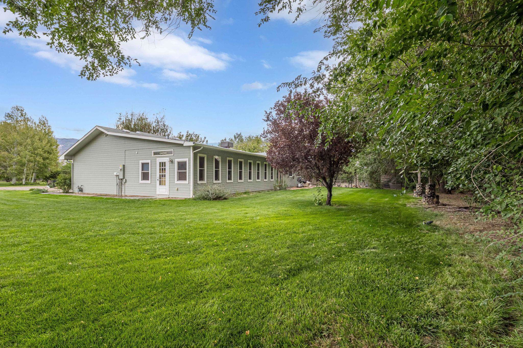3613 G Road, Unit E Palisade, CO 81526 - Photo 41 of 42 a view of an house with backyard and garden