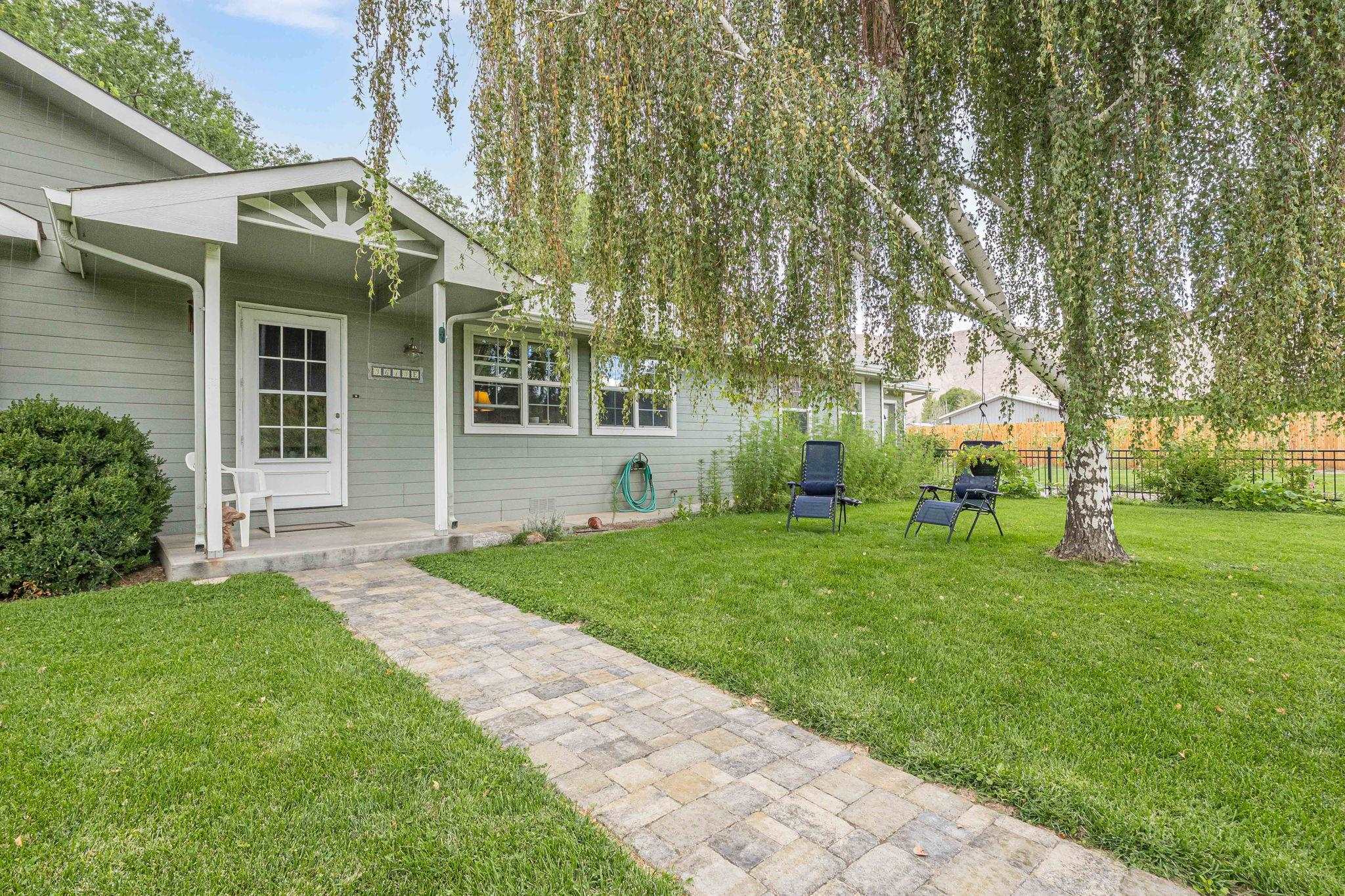 3613 G Road, Unit E Palisade, CO 81526 - Photo 5 of 42 a front view of a house with garden