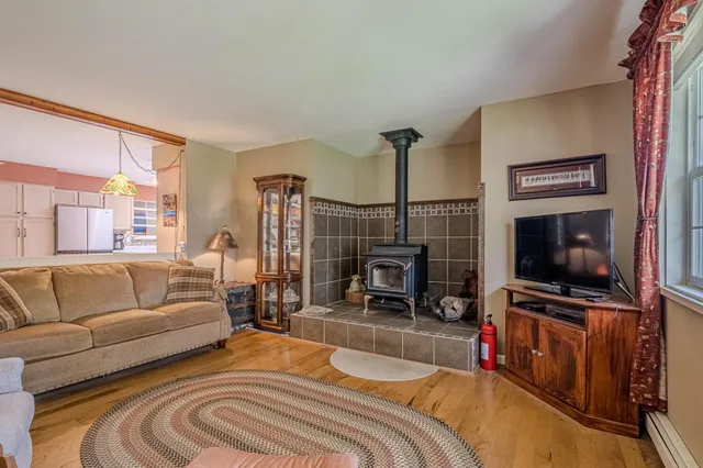 a bedroom with furniture and a flat screen tv