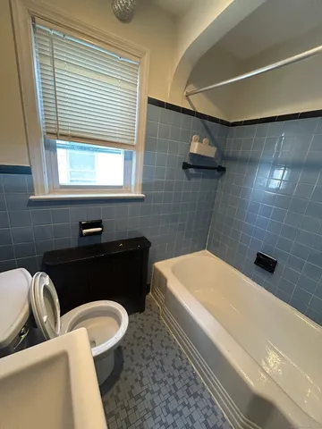 a bathroom with a bathtub and a sink