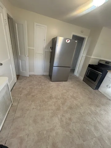 a view of a refrigerator in kitchen