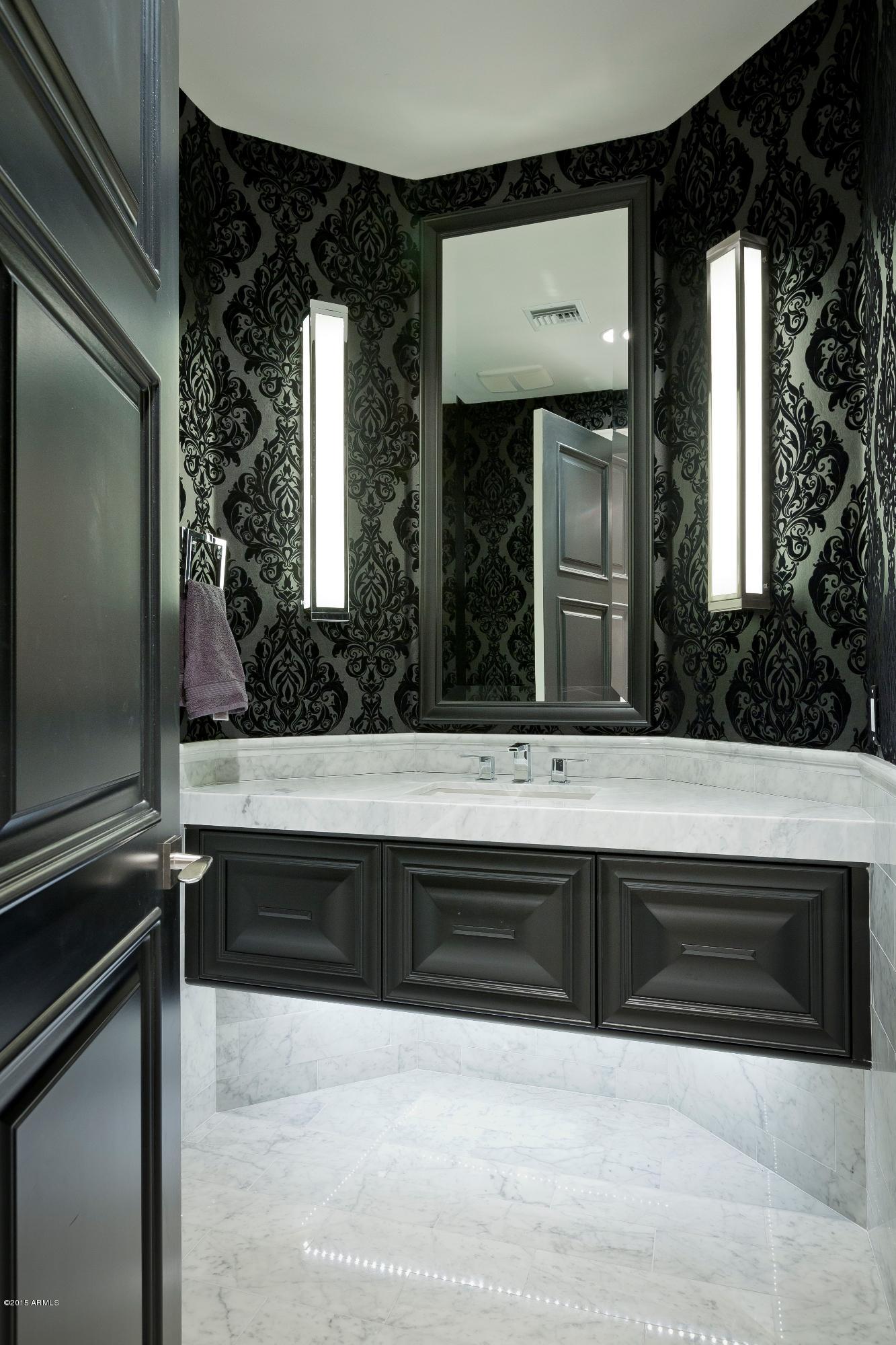 10040 East Happy Valley Road, Unit 14 Scottsdale, AZ 85255 - Photo 15 of 21 a bathroom with a sink and a mirror