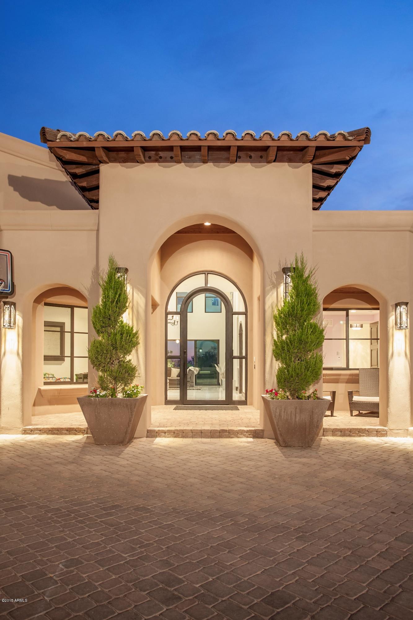 10040 East Happy Valley Road, Unit 14 Scottsdale, AZ 85255 - Photo 2 of 21 a view of a house with a yard