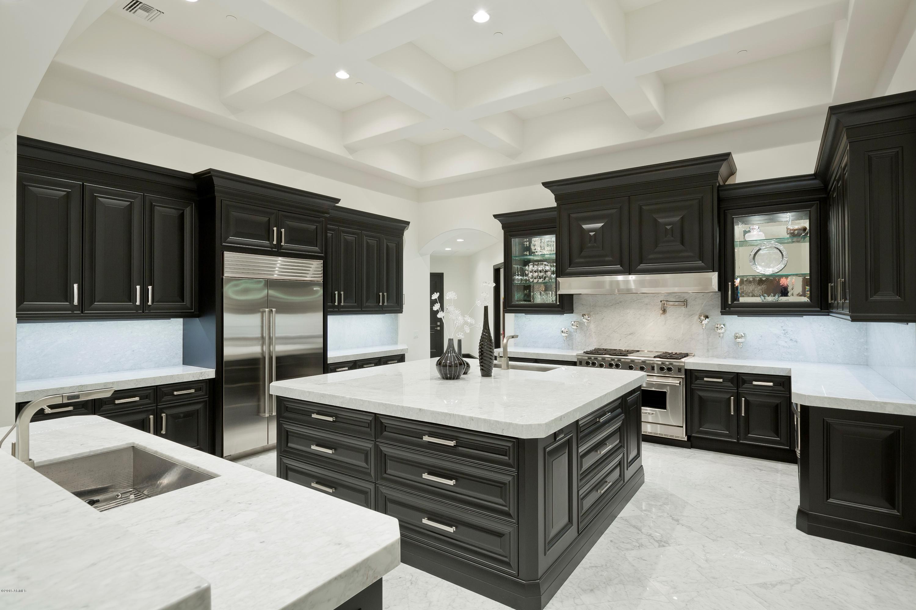 10040 East Happy Valley Road, Unit 14 Scottsdale, AZ 85255 - Photo 6 of 21 a kitchen with stainless steel appliances granite countertop a sink stove and refrigerator