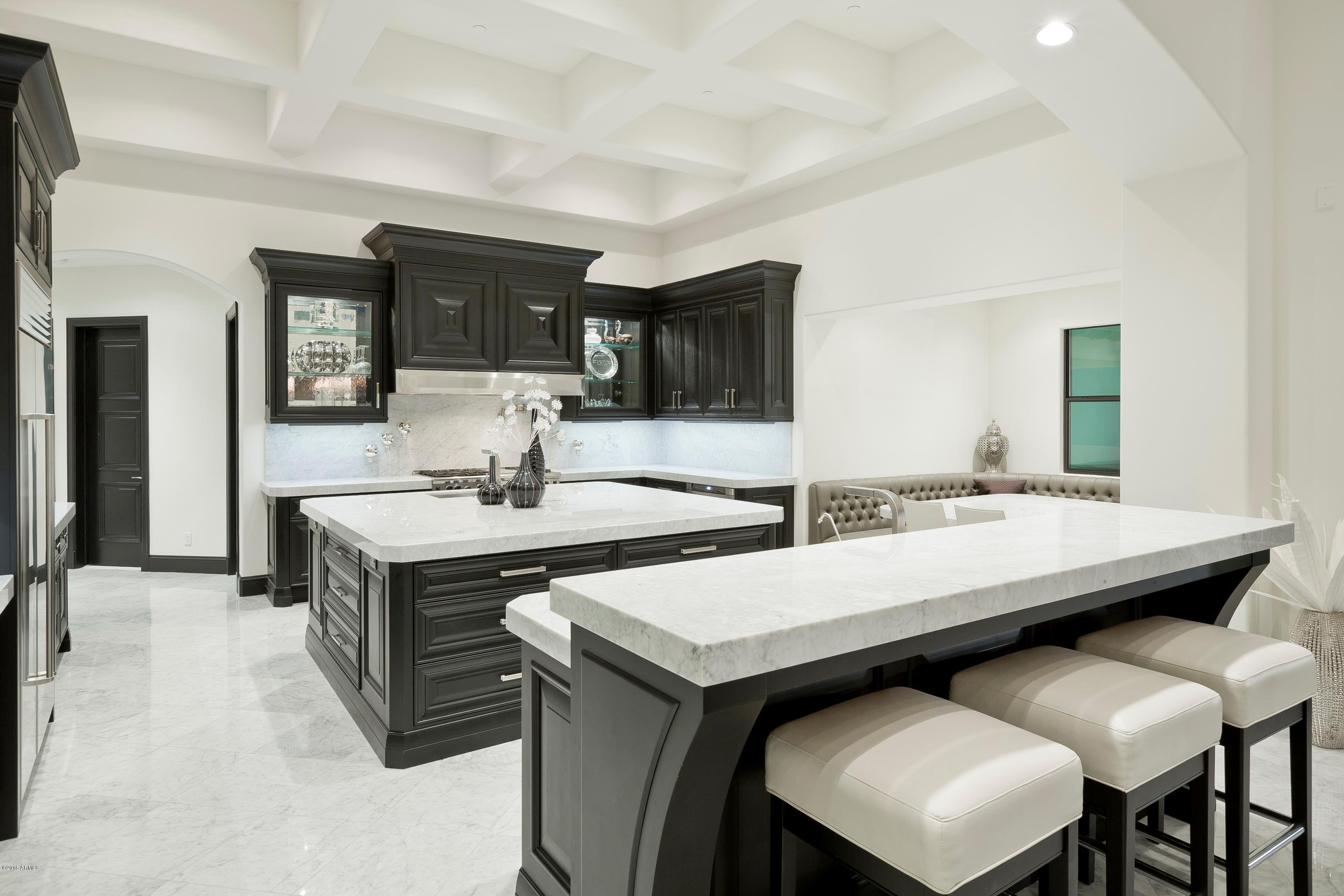 10040 East Happy Valley Road, Unit 14 Scottsdale, AZ 85255 - Photo 7 of 21 a view of kitchen island a sink and living room