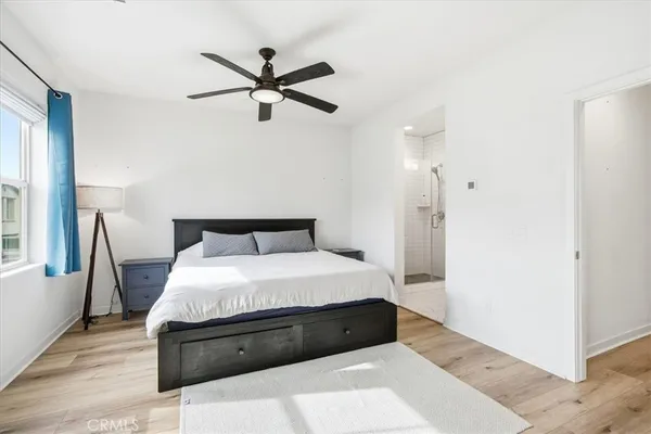 a bedroom with a bed and window