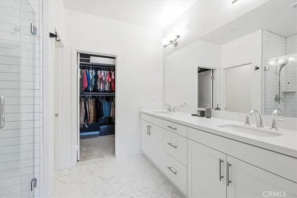 a en suite bathroom with a sink and a mirror