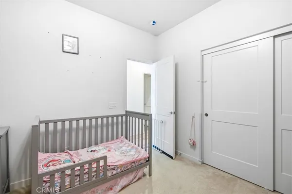 a bedroom with bed and a window