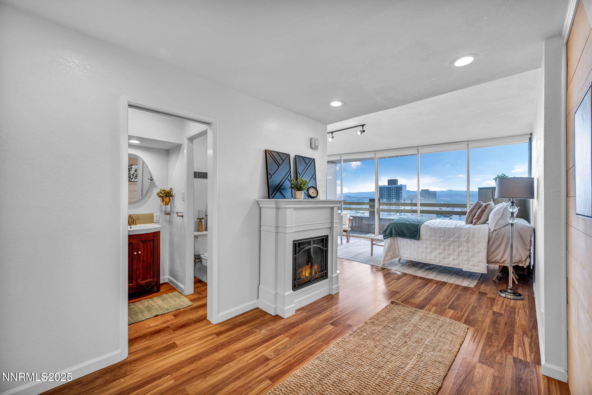 100 North Arlington Avenue, Unit 22C Reno, NV 89501 - Photo 13 of 34 a living room with furniture and a fireplace