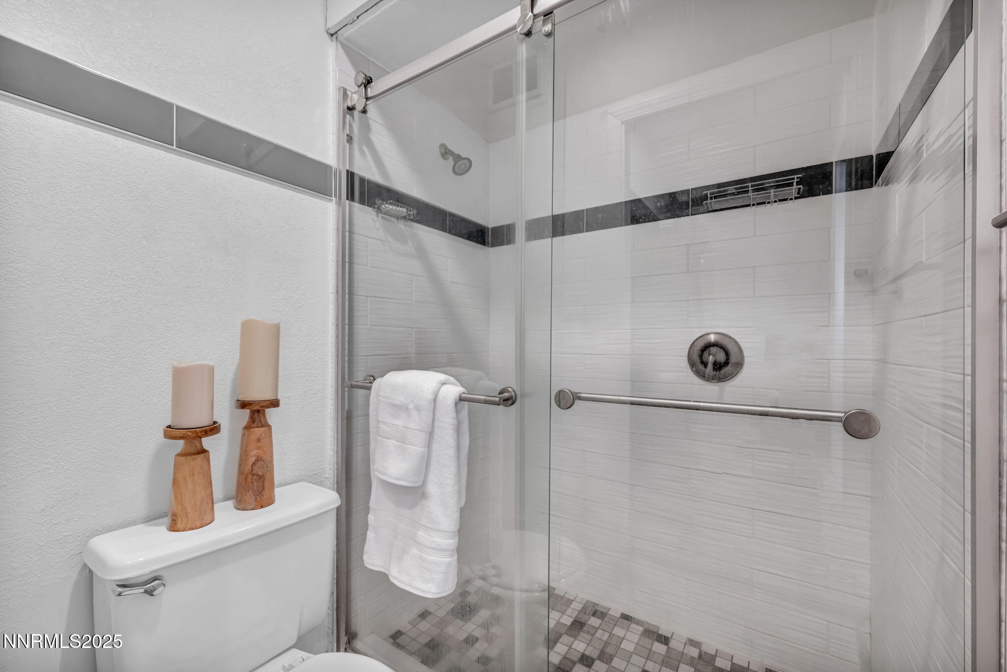 100 North Arlington Avenue, Unit 22C Reno, NV 89501 - Photo 16 of 34 a bathroom with a shower and toilet
