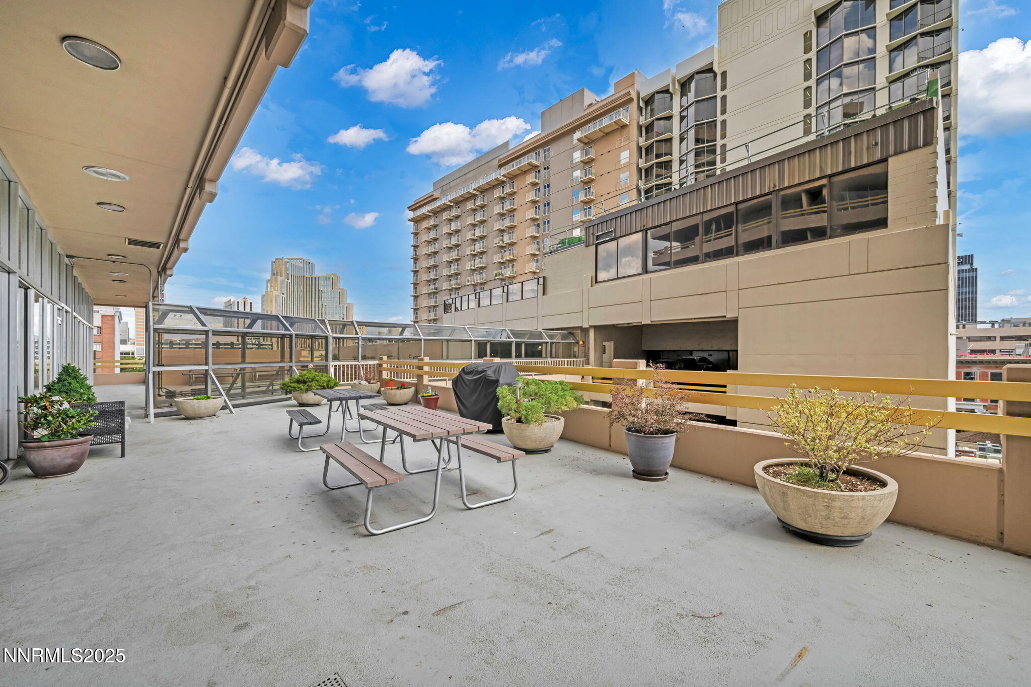 100 North Arlington Avenue, Unit 22C Reno, NV 89501 - Photo 34 of 34 a view of a patio with couches and potted plants