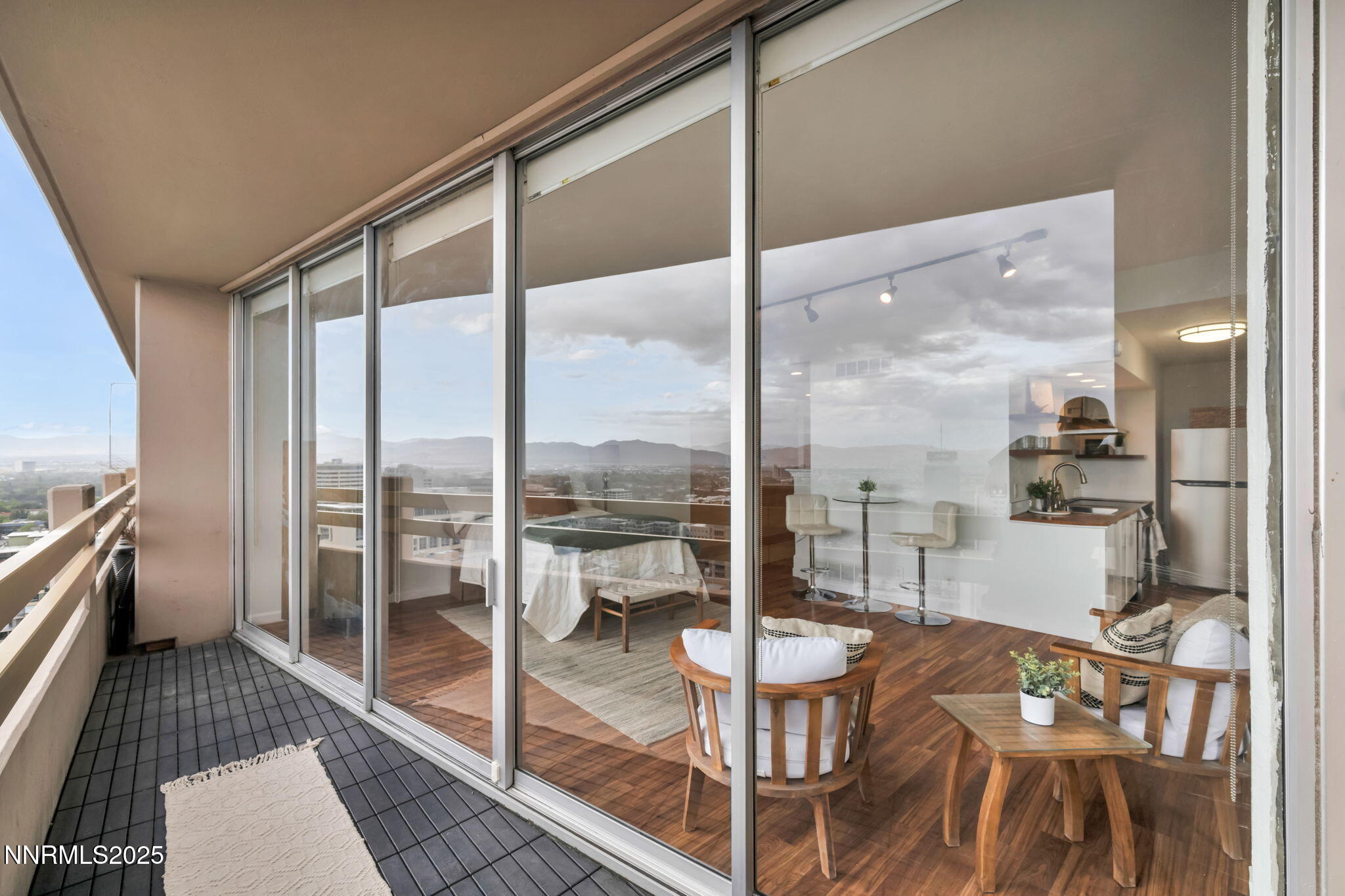 100 North Arlington Avenue, Unit 22C Reno, NV 89501 - Photo 4 of 34 a very nice looking room with a large window and furniture