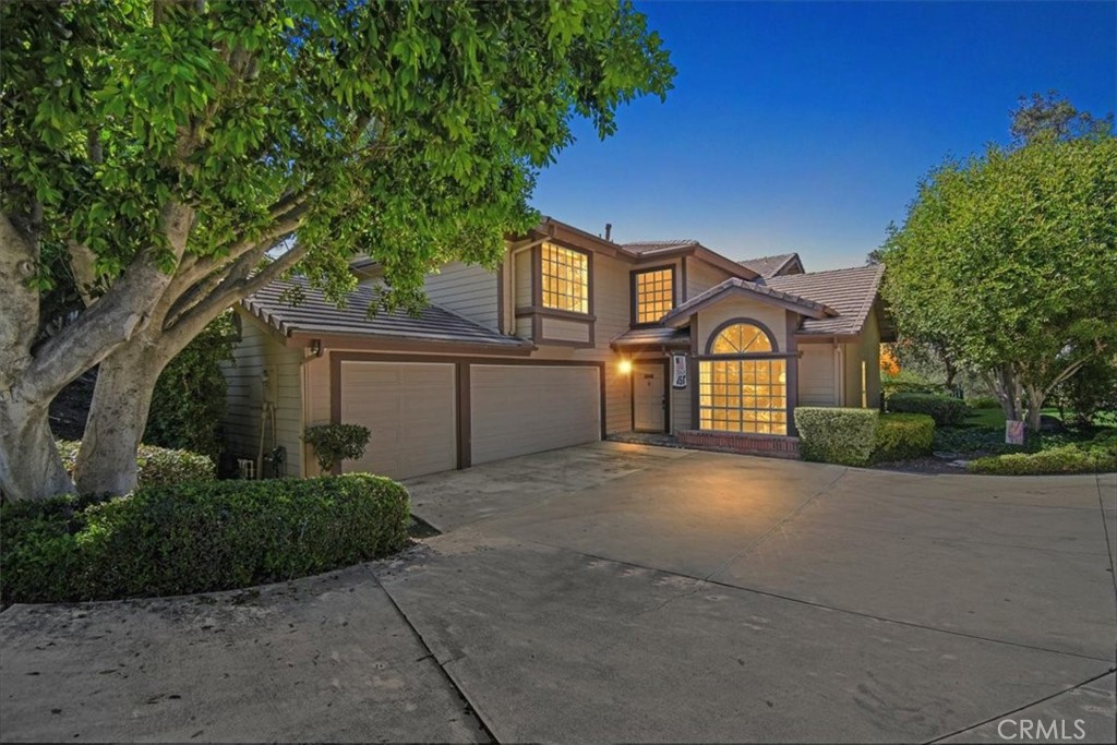 16580 Treetop Lane Riverside, CA 92503 - Photo 1 of 1 a front view of a house with a yard and garage