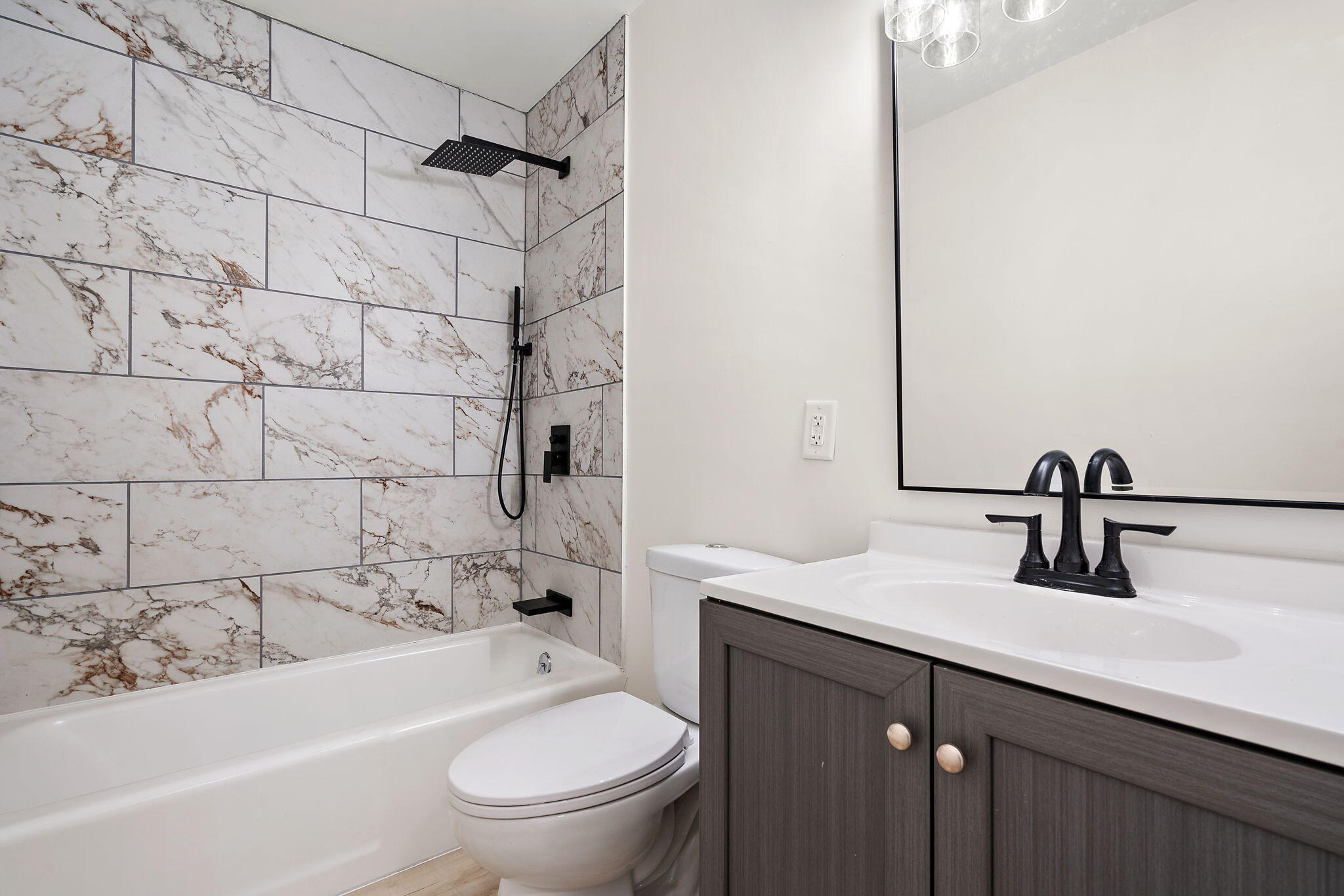 654 Cheyenne Drive Lowell, IN 46356 - Photo 7 of 11 a bathroom with a sink a toilet and shower
