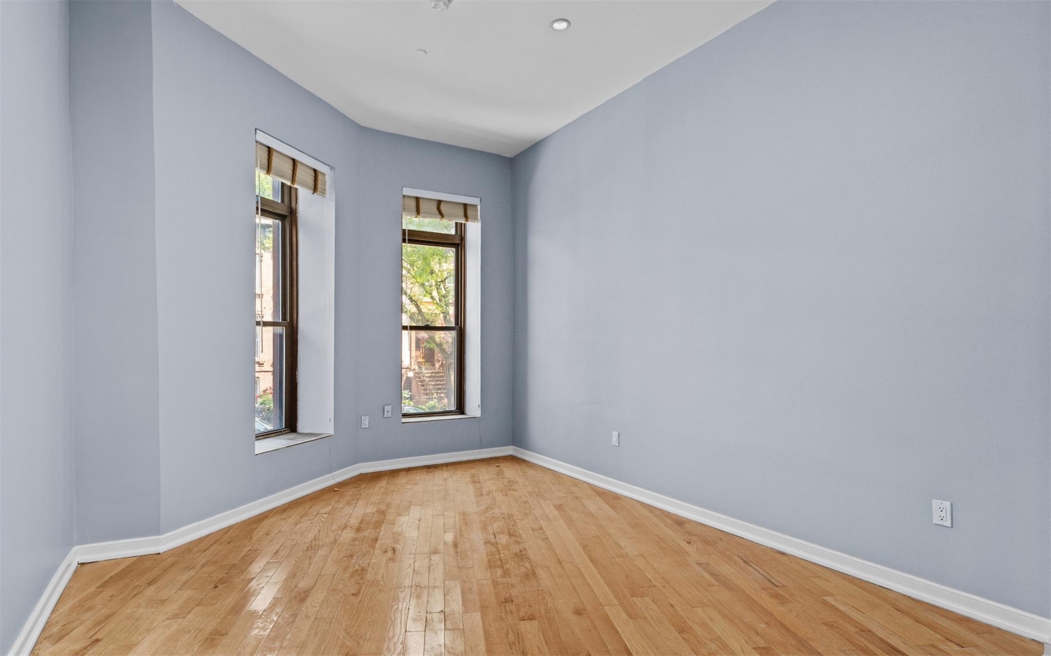 626 Madison Street Brooklyn, NY 11221 - Photo 12 of 42 Spare room featuring light wood-style floors and baseboards