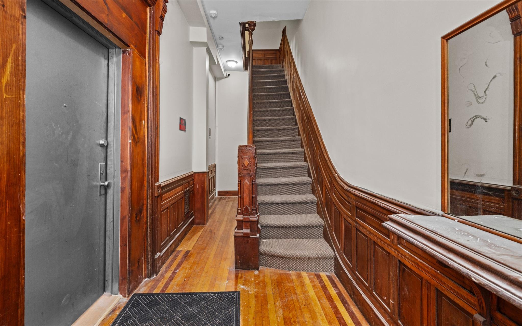 626 Madison Street Brooklyn, NY 11221 - Photo 2 of 42 Stairs with wood-type flooring and wainscoting