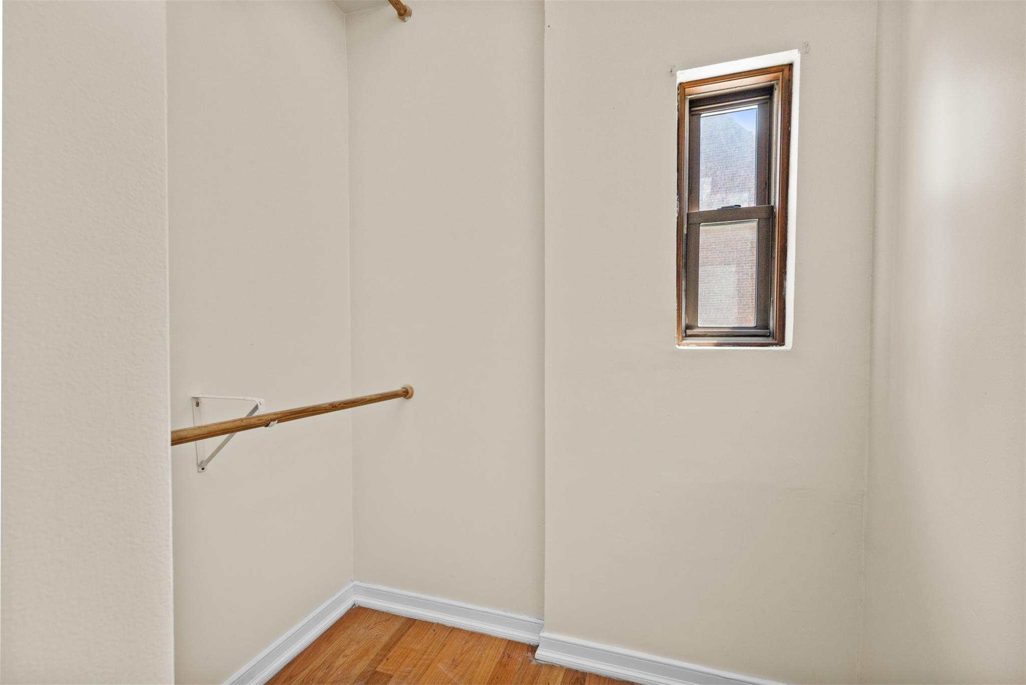 626 Madison Street Brooklyn, NY 11221 - Photo 29 of 42 Walk in closet featuring light wood-style floors