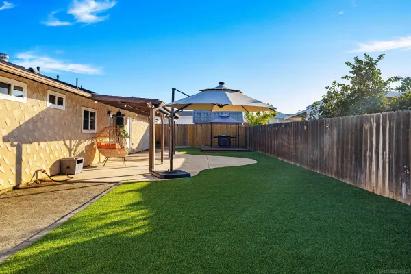 a view of outdoor space with wooden floor and fence
