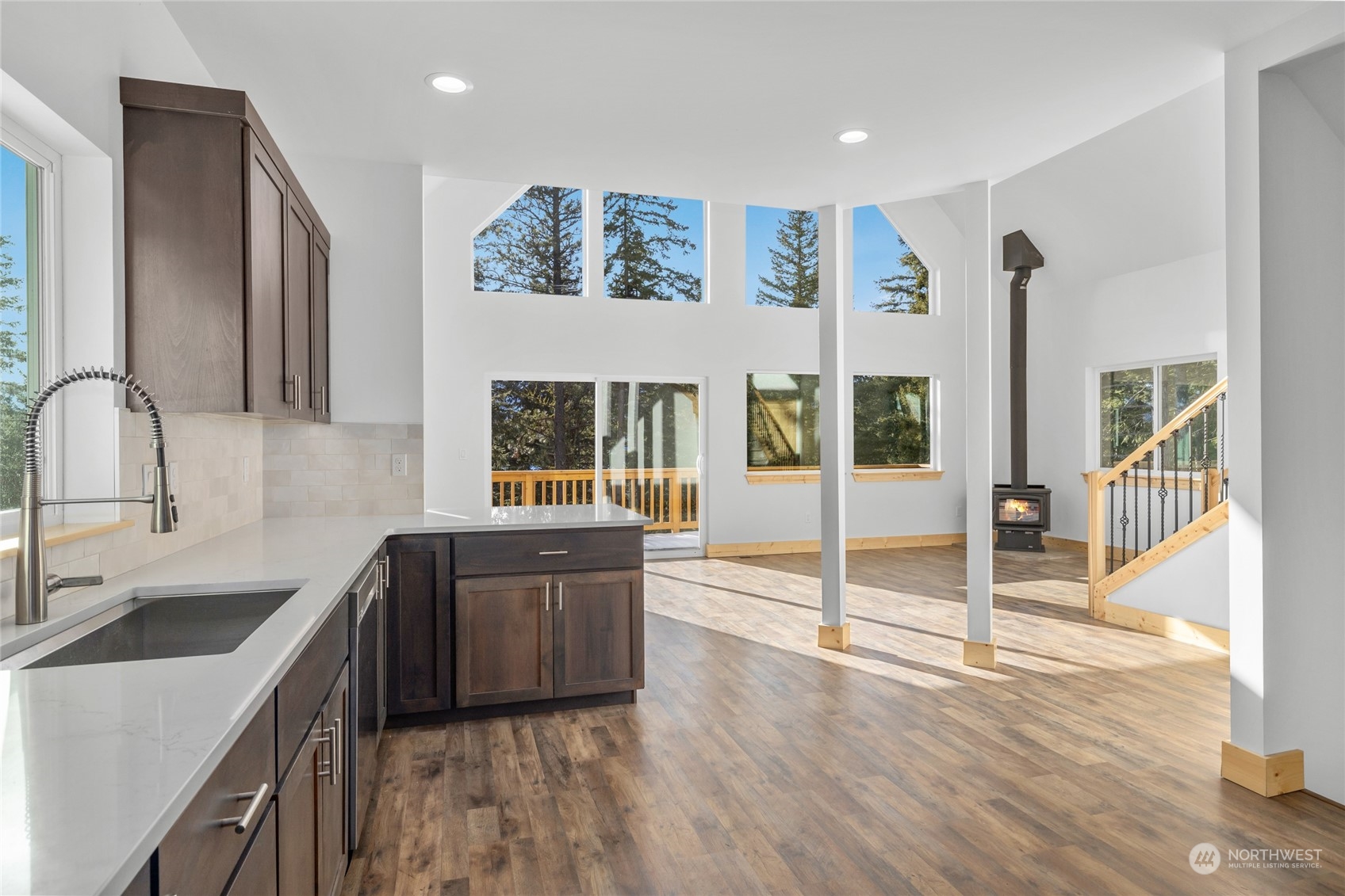 1089 Highland Loop Ronald, WA 98940 - Photo 7 of 40 a kitchen with stainless steel appliances granite countertop a sink stove and wooden cabinets