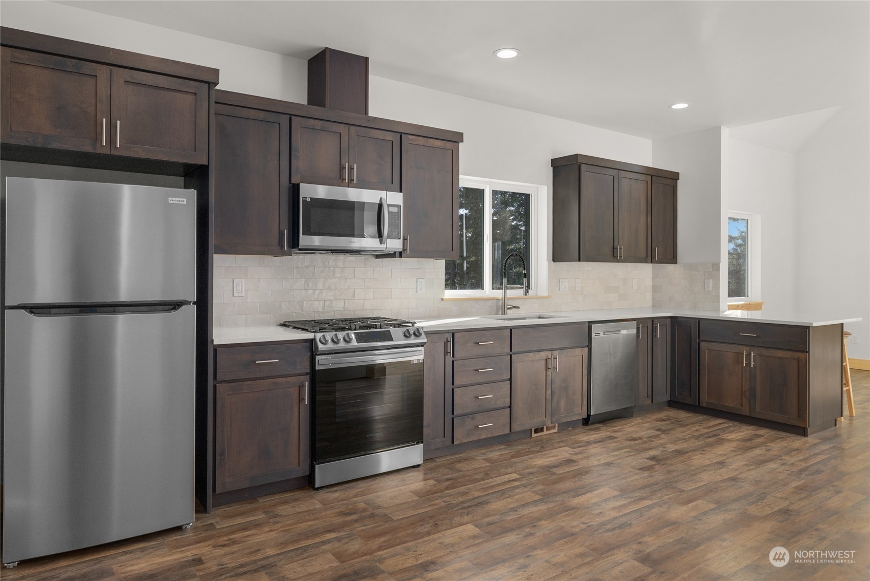 1089 Highland Loop Ronald, WA 98940 - Photo 8 of 40 a kitchen with stainless steel appliances granite countertop a refrigerator microwave and sink
