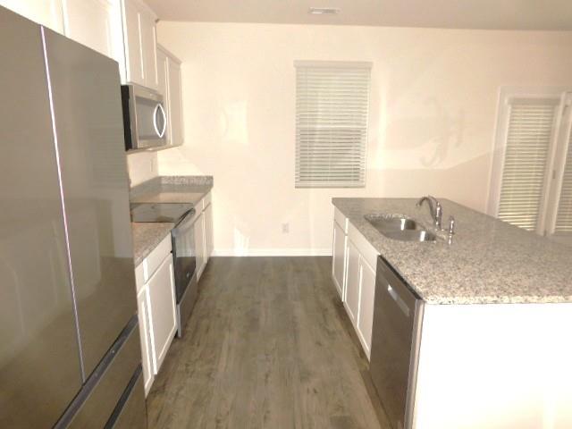 3689 Chevington Court Southeast Atlanta, GA 30354 - Photo 13 of 30 a bathroom with a granite countertop sink a washer and dryer