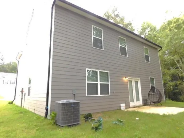 a brick house with a yard