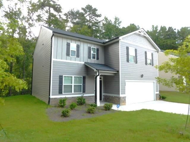 3689 Chevington Court Southeast Atlanta, GA 30354 - Photo 3 of 30 a front view of a house with a yard and garage