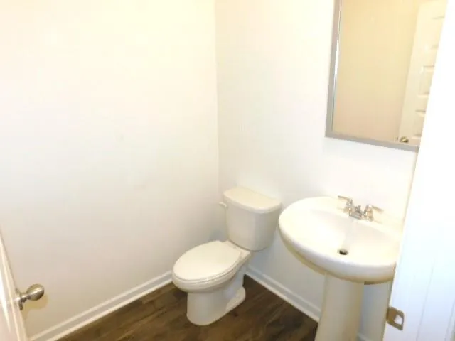 a bathroom with a toilet and a sink