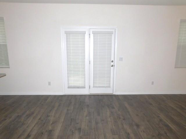 3689 Chevington Court Southeast Atlanta, GA 30354 - Photo 9 of 30 an empty room with wooden floor and windows