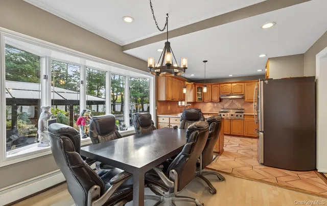 a view of a dining room with furniture window and outside view