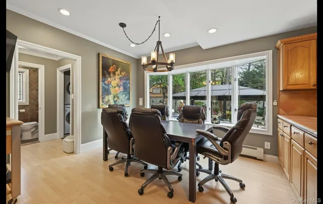 a view of a dining room with furniture window and outside view
