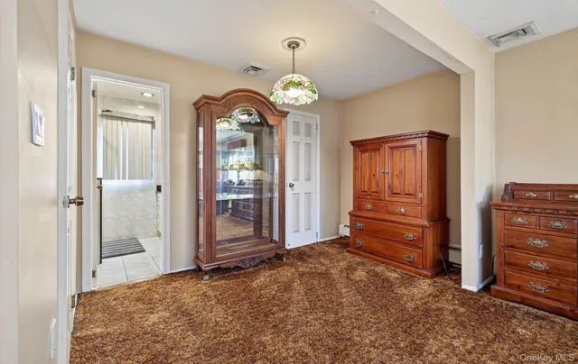 wooden floor in an empty room with a mirror