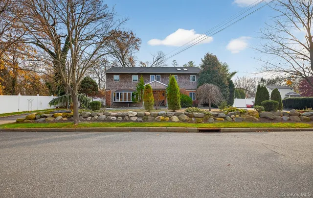 a view of swimming pool with a yard and large trees