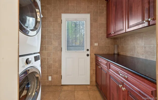 a view of a storage and utility room with washer and dryer