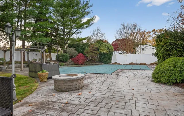 a view of a backyard with garden and plants