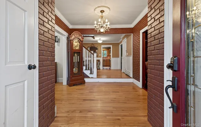 a view of a hallway with a chandelier