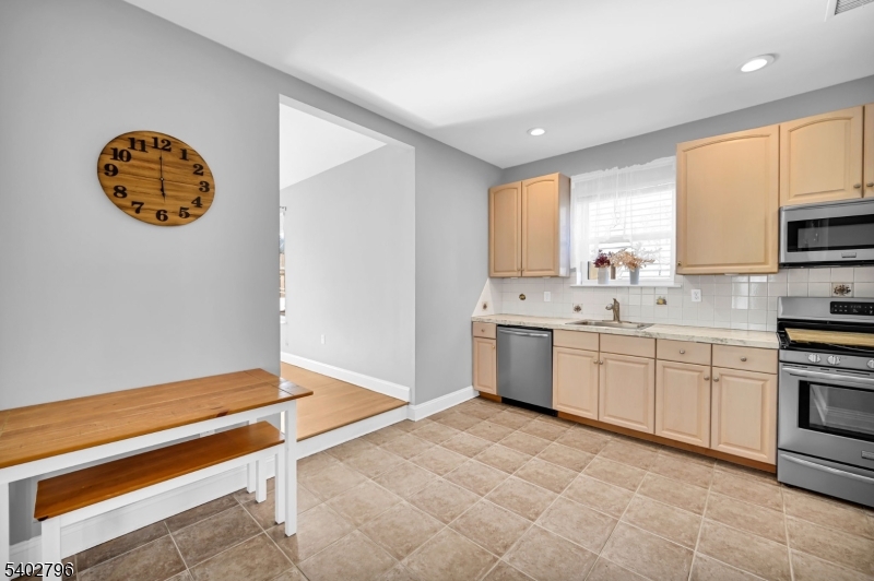 48 Main Avenue Wallington, NJ 07057 - Photo 11 of 50 a kitchen with a sink cabinets and window