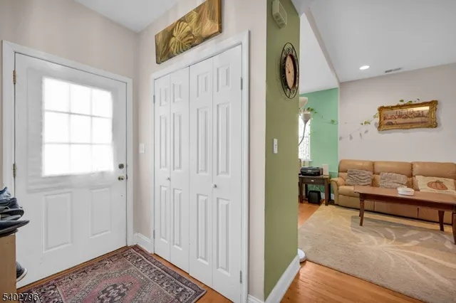 a view of a livingroom with furniture and windows