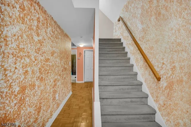 a view of staircase with white walls