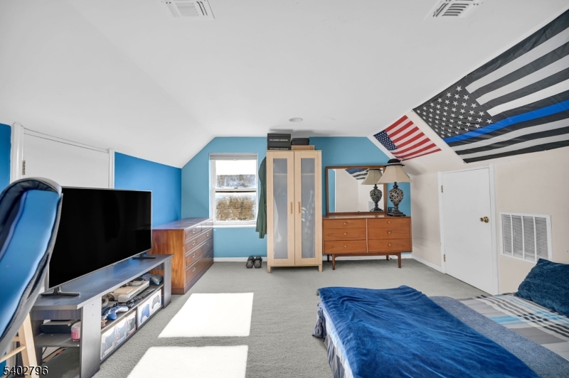 48 Main Avenue Wallington, NJ 07057 - Photo 40 of 50 a bedroom with furniture and a window