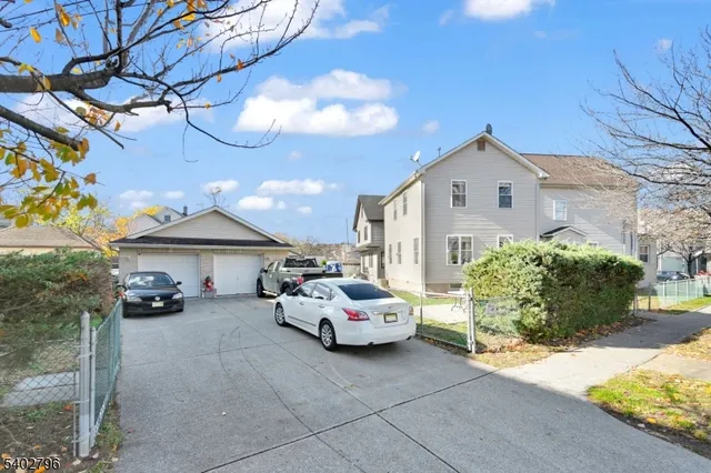 a car parked in front of white house