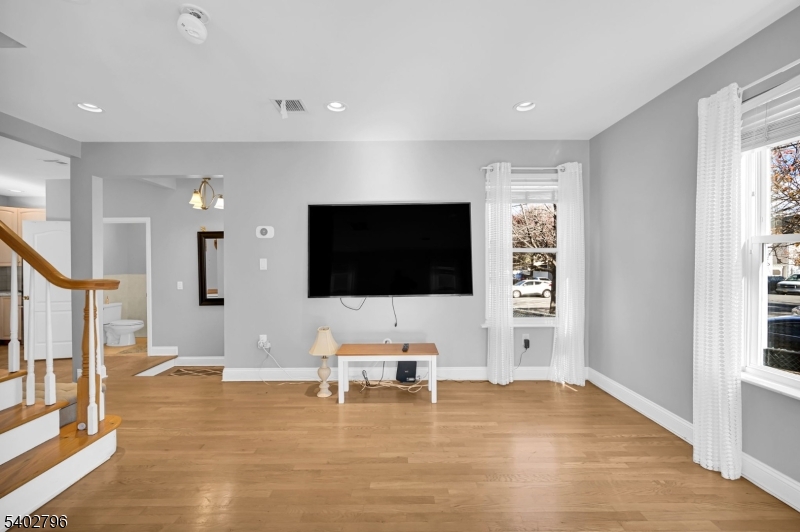 48 Main Avenue Wallington, NJ 07057 - Photo 7 of 50 a living room with furniture and a flat screen tv